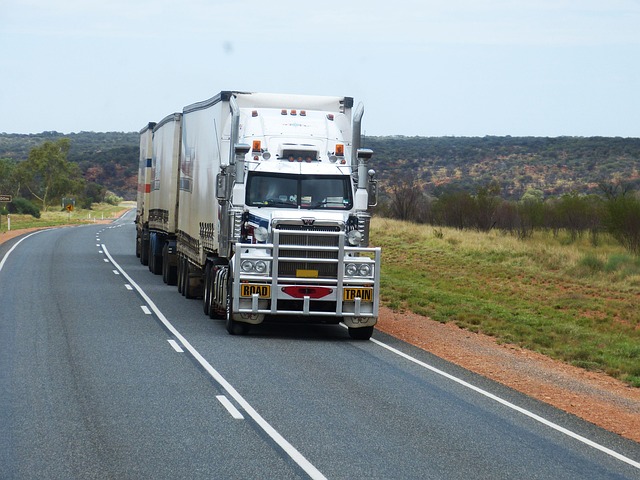 grain transport truck trailer loading at farm